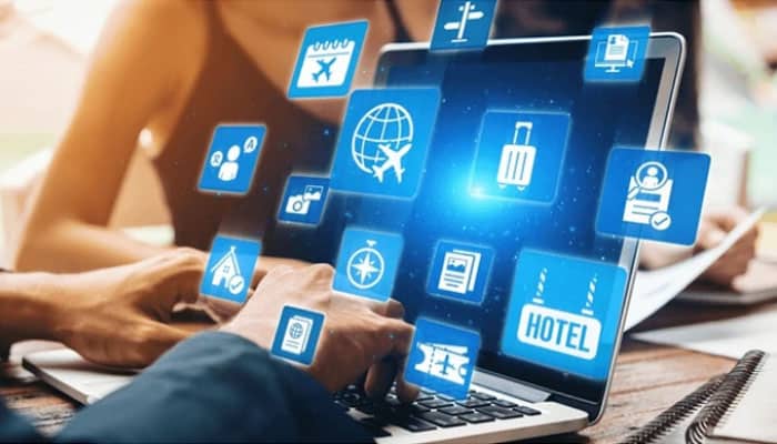 Auto Insurance News: Latest Updates on Rates, Coverage, and Industry Trends - finsurancebiz - Finsurancebiz Person using a laptop with digital icons related to Auto Insurance 2026 and various online services, symbolizing modern insurance options and tech-driven solutions.