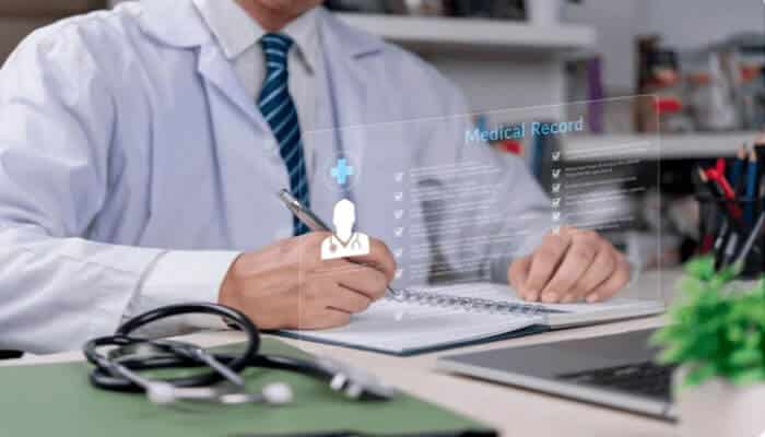 Top Reasons People Are Disqualified from Long-Term Care Insurance - finsurancebiz - Finsurancebiz A doctor reviewing a medical record with digital data, symbolizing the importance of medical history in determining eligibility for long-term care insurance.