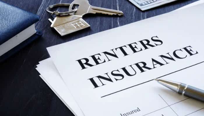 List of Common Insurance Types and What They Protect Against - finsurancebiz - Finsurancebiz Renters insurance documents on a desk with a pen and house keys, representing common insurance types that protect personal belongings in a rental home.