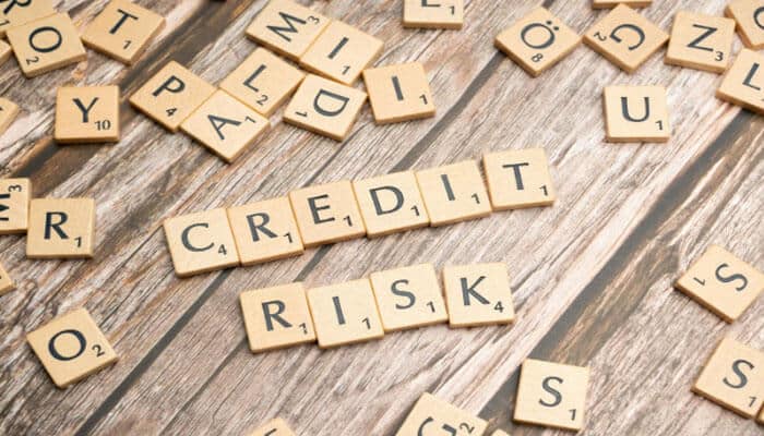 How TransUnion Helps Businesses Manage Credit and Financial Risk - finsurancebiz - Finsurancebiz TransUnion Credit Risk Management concept illustrating credit risk analysis using letter tiles spelling credit risk for business financial decisions