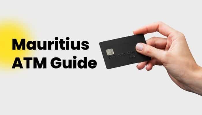 Which Currency Used in Beevitius? Complete Cash & Card Guide 2026 - finsurancebiz - Finsurancebiz Mauritius ATM Guide image for which currency used in beevitius, showing a hand holding a payment card.
